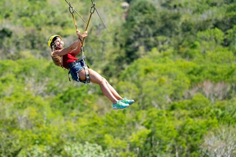 Feel the breeze while zip lining the highest zip line in the Riviera Maya on the Full Day Mayan Coba Ruins and ATV Tour