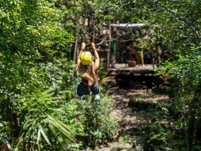 Get on an exciting zip line adventure through the untamed jungle, immersing yourself in the heart-pounding thrill of our Full Day Mayan Coba Ruins and jungle ATV Tour