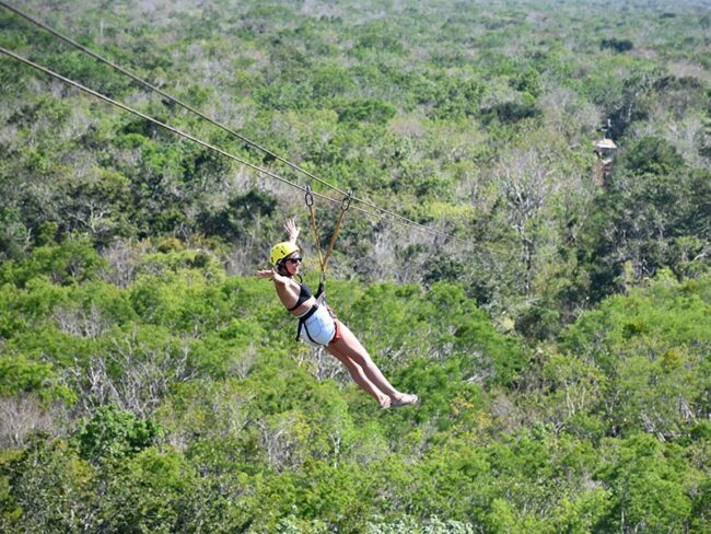 Go on a family vacation to Tulum Tours From Riviera Maya and get the amazing chance of flying between the trees of the jungle on a zip line!