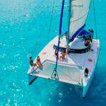 Sit back and enjoy this incredible view of the turquoise water while sailing through our half day sail cat