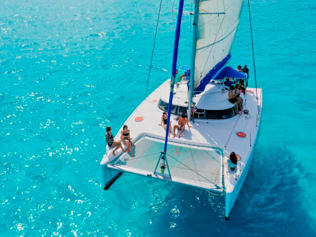 Sit back and enjoy this incredible view of the turquoise water while sailing through our half day sail cat