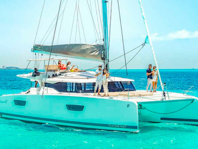 Get onboard on this Luxurious Catamaran to Isla Mujeres and live the moment while watching the bright turquoise sea water.