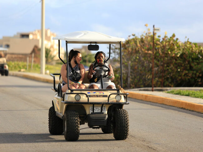 Get to know Isla Mujeres on our luxurious catamaran tour and explore the island by driving a golf cart.