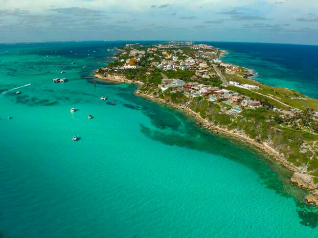 Admire and explore the beautiful caribbean sea on a half day Private Catamaran 45 guests adventure to Isla Mujeres