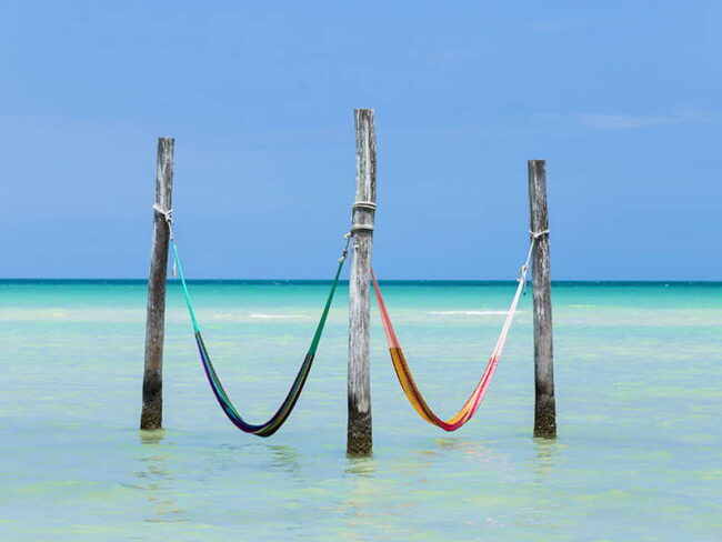 One of the best things to do in Holbox, is to just relax on the hammocks while being in the ocean and enjoying its magnificent beach view, get ready for a Full Day Holbox Excursion!