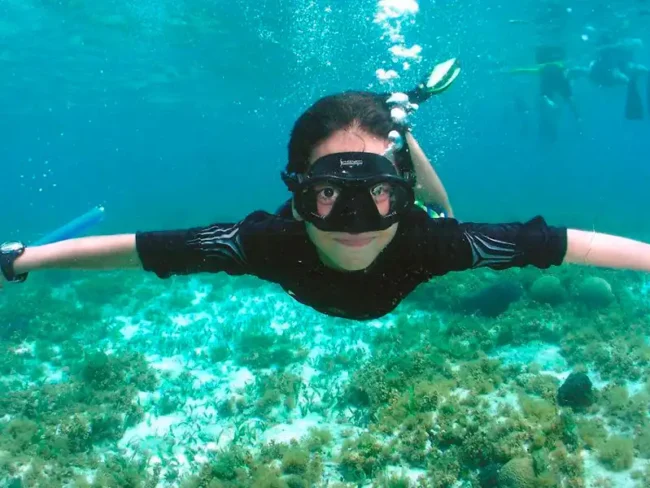 Jump in crystal clear waters and snorkel while having fish around you. Enjoy the amazing view of the colourful reef in the Sail Cat 30 Guests private tour to Isla Mujeres