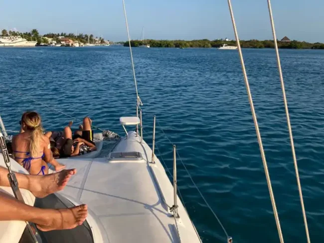 Go on a nice Sail Cat 30 Guests boat ride from Cancun to Isla Mujeres. Listen to your favourite music, relax under the shaded area, or give yourself a tan on the catamaran's net