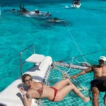 This Full Day Sail Cat 30 Guest tour to Isla Mujeres is equipped with shade, toilets, and comfortable trampolines/nets to take the sun