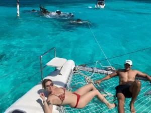 This Full Day Sail Cat 30 Guest tour to Isla Mujeres is equipped with shade, toilets, and comfortable trampolines/nets to take the sun