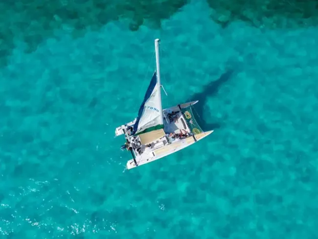 Spend an amazing time at the half day private catamaran tour to Isla Mujeres and get the chance to sail through the crystal-clear waters