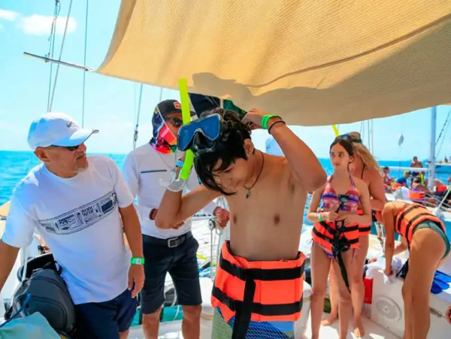 Get onboard on a half day private catamaran with a shaded area on our sailing tour to Isla Mujeres