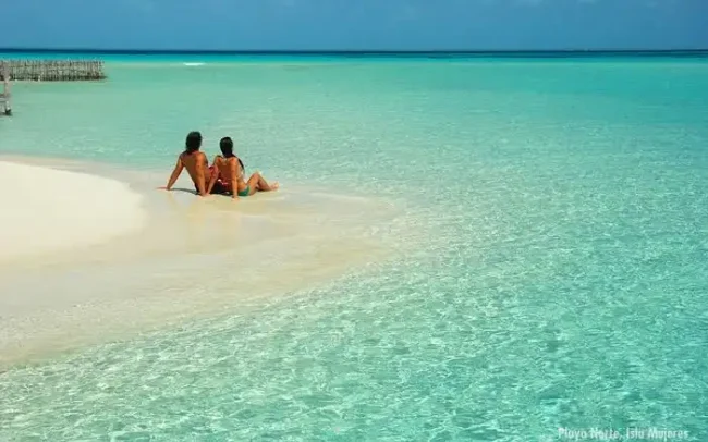 Escape to this crystal clear beach without seaweed and relax in full tranquility here at the half day Private catamaran 45 guests to Isla Mujeres