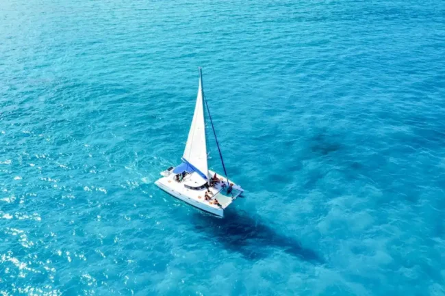 Get onboard on a half day Private Catamaran perfect for up to 45 guests and take a moment to chill while being sun kissed on a beautiful sunny day surrounded by the turquoise crystal clear sea on your way to explore Isla Mujeres