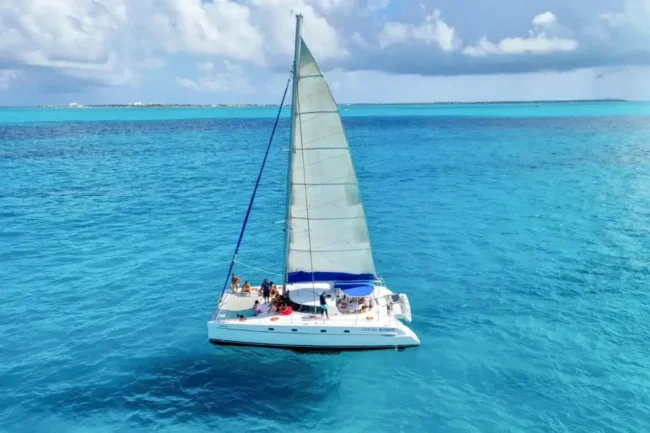 Sail your way to Isla Mujeres through the crystal clear waters of the caribbean sea at the half day Private Catamaran 45 guests experience