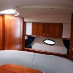 Private Yacht for Twelve Passengers in Cancun offers a comfortable Cabin with places to sit and a table