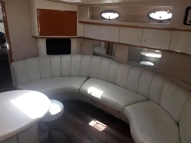 Living room located in the cabin with a comfy sofa / Private Yacht in Cancun: Sea Ray 45ft 15 Passengers