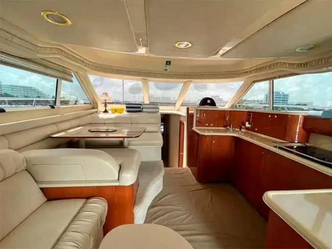 Private Yacht perfect size for 20 People - Spacious cabin with a mini kitchen, bluetooth speakers, comfy seats, tables, and windows for the amazing view in Cancun